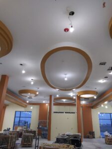 Commercial lighting and fire alarm installation on a ceiling by Grace Electric Co. in Des Moines, IA.