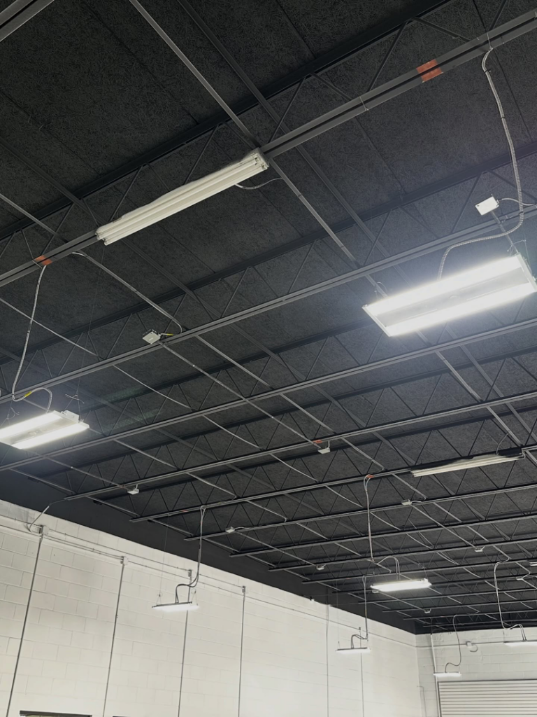 Commercial lighting installation and wiring on a ceiling by Bold City Electric in Jacksonville, FL.