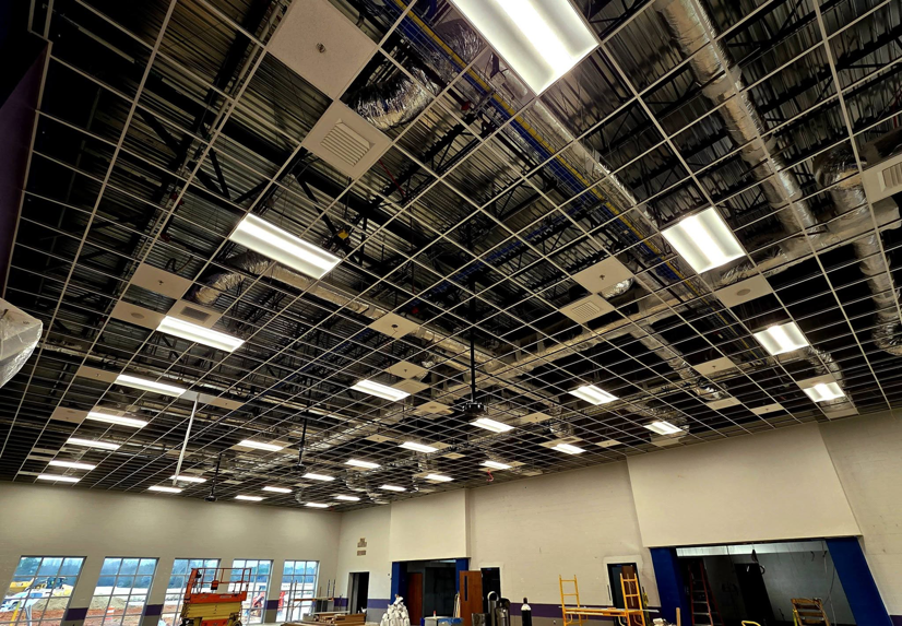 Commercial lighting and electrical conduit installation in a large room by Coats Electric Company, Inc in Florence, AL.