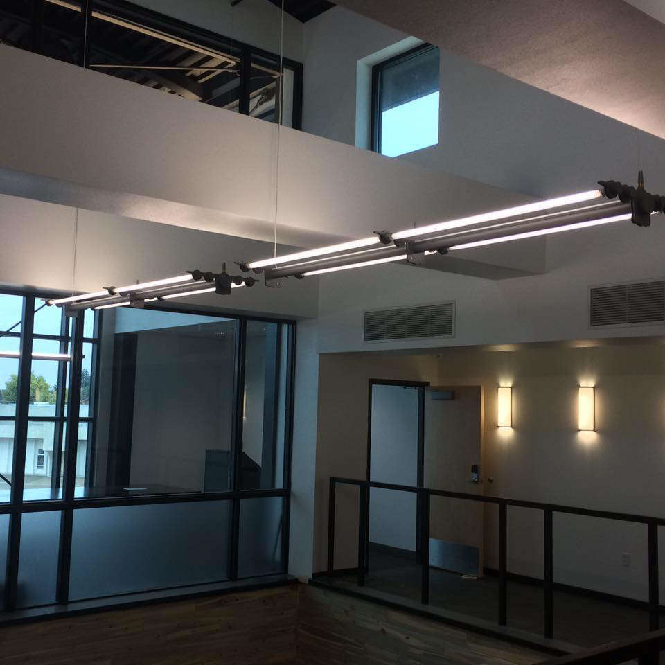 Professionally installed commercial lighting fixtures in a modern building by Glanz Electrical Contracting, Inc in Fort Collins, CO.