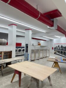 New fluorescent lighting installed in a commercial laundry room under construction by Industrial Edge Electrical in Gilbert, AZ.