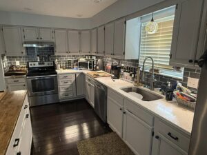 Commercial lighting installation with track and pendant lights by Power'd Up Electric, LLC in Clinton, TN.