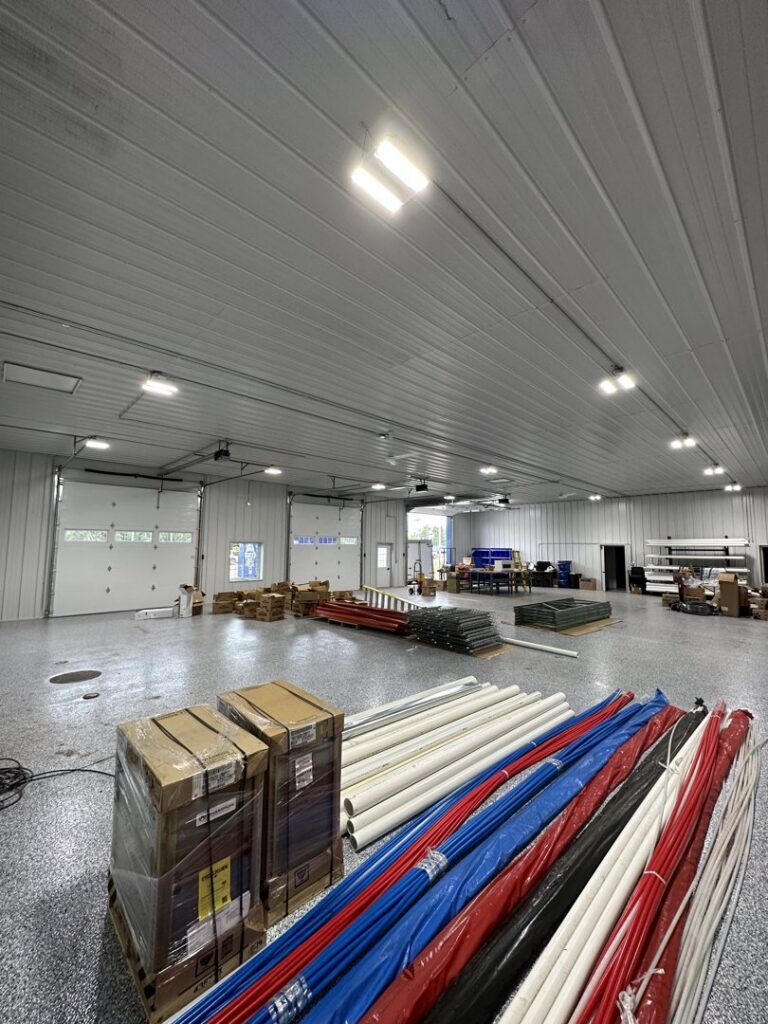 New commercial overhead lighting installed in a large garage or warehouse by Schroeder Electric in Duluth, MN.