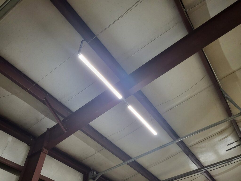 Commercial interior lighting installation with bright LED tube lights by Spencer Electric in Hopkins, MN.