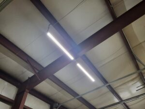Commercial interior lighting installation with bright LED tube lights by Spencer Electric in Hopkins, MN.