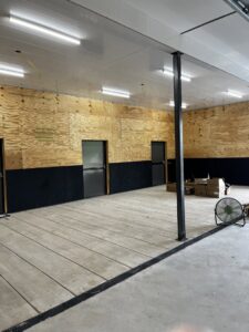 New fluorescent lighting installed on the ceiling of a commercial space under construction, completed by Superior Electrical Solutions llc in Clear Spring, MD.