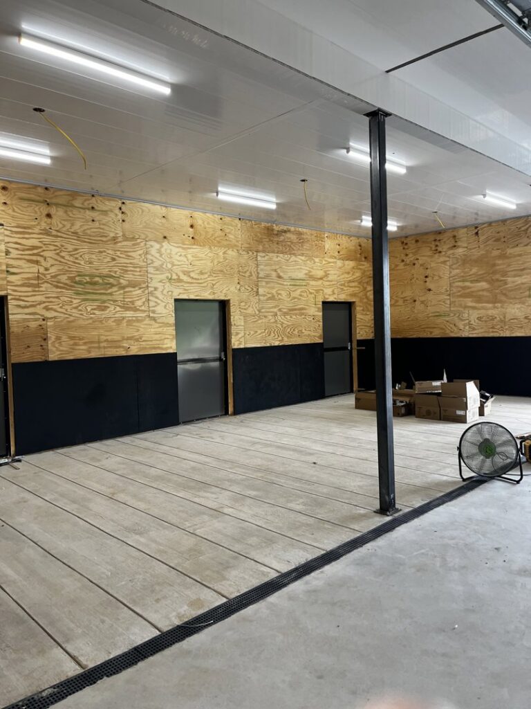 New fluorescent lighting installed on the ceiling of a commercial space under construction, completed by Superior Electrical Solutions llc in Clear Spring, MD.