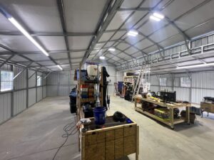 Interior of a workshop showing commercial lighting installation by Geter Electrical Services LLC in Fountain Inn, SC.