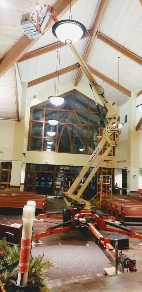 A JLG lift used for commercial lighting maintenance by Big City Lighting and Electric in Houston, TX.
