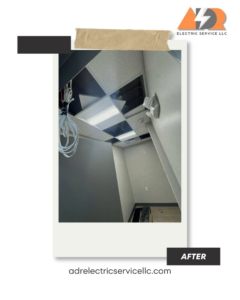 Commercial lighting and wiring installation in a grid ceiling, showing exposed wires and new fixtures by ADR Electric in Indianapolis, IN.