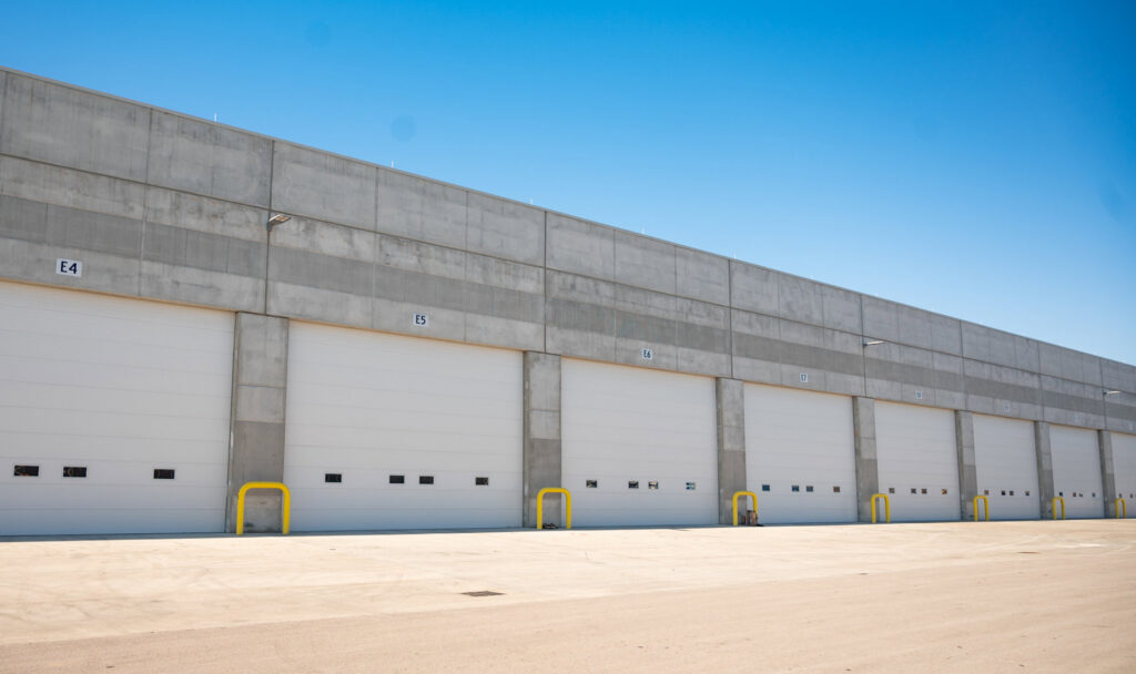 A row of commercial loading dock doors installed by Rose Quality Garage Doors in Murfreesboro, TN