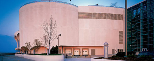 A large commercial building featuring multiple loading dock doors installed by Overhead Door Company of Knoxville in Knoxville, TN