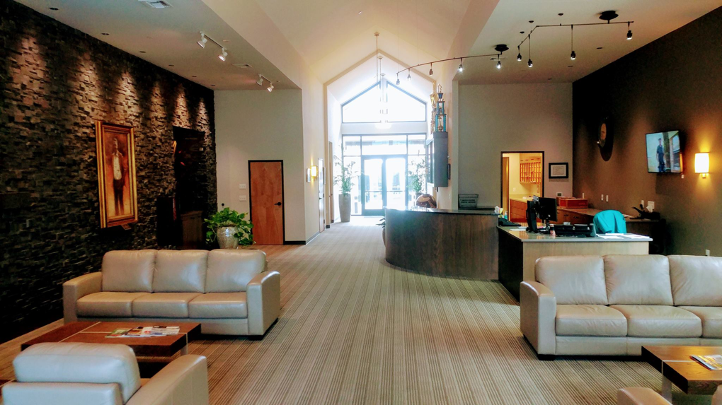 A clean commercial lobby with striped carpet, showcasing a completed project by Sparkle and Clean Janitorial LLC in Salem, OR.
