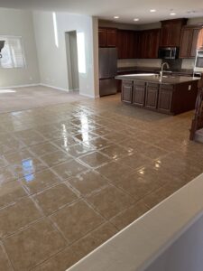 A commercial mat or rug being cleaned, showing a clear before and after result by Triple J Carpet Cleaning in North Las Vegas, NV.