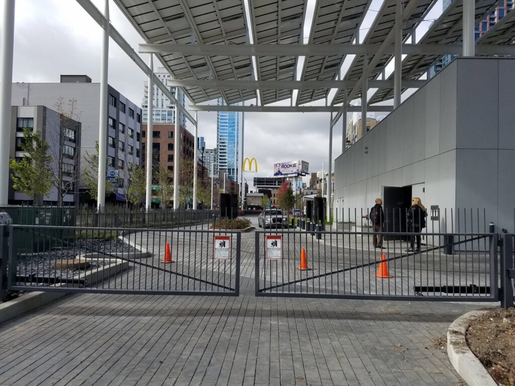 Commercial metal swing gates installed at an urban entrance by Gate Options in West Chicago, IL