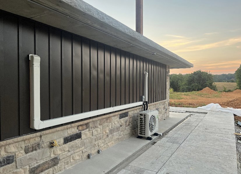 A commercial mini-split outdoor HVAC unit installed on the exterior of a building by Top Notch Heating and Air Conditioning in Bowling Green, KY.