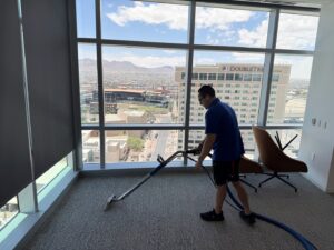 A professional cleaning commercial office carpet with a cleaning wand by DEEP CLEAN Carpet Cleaners in Beaverton, OR