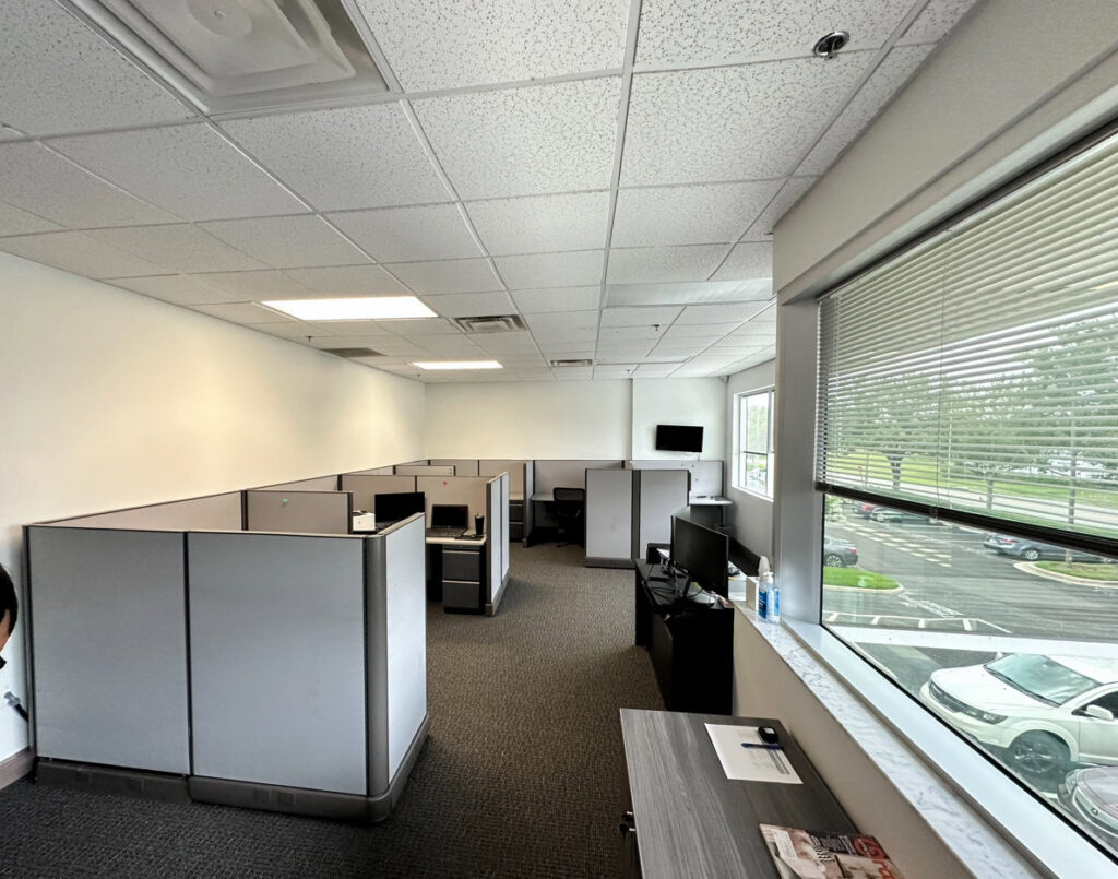 Commercial office space with new dark grey carpet installed by Floored Solutions and Services, LLC in Orlando, FL.