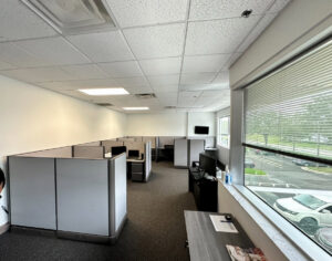 Commercial office space with new dark grey carpet installed by Floored Solutions and Services, LLC in Orlando, FL.