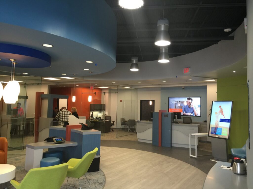 Commercial office or bank lobby with modern lighting and digital displays installed by Performance Electrical Contracting Inc. in Jacksonville, FL