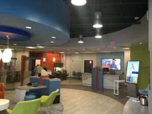 Commercial office or bank lobby with modern lighting and digital displays installed by Performance Electrical Contracting Inc. in Jacksonville, FL