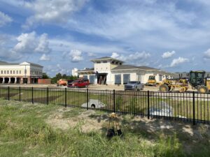 A black ornamental iron fence installed in front of a commercial property by Covenant Fence in Columbia, SC.