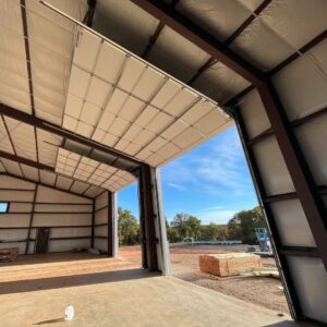Interior view of a large commercial overhead door installation by CCM Overhead Doors in Oklahoma City, OK.