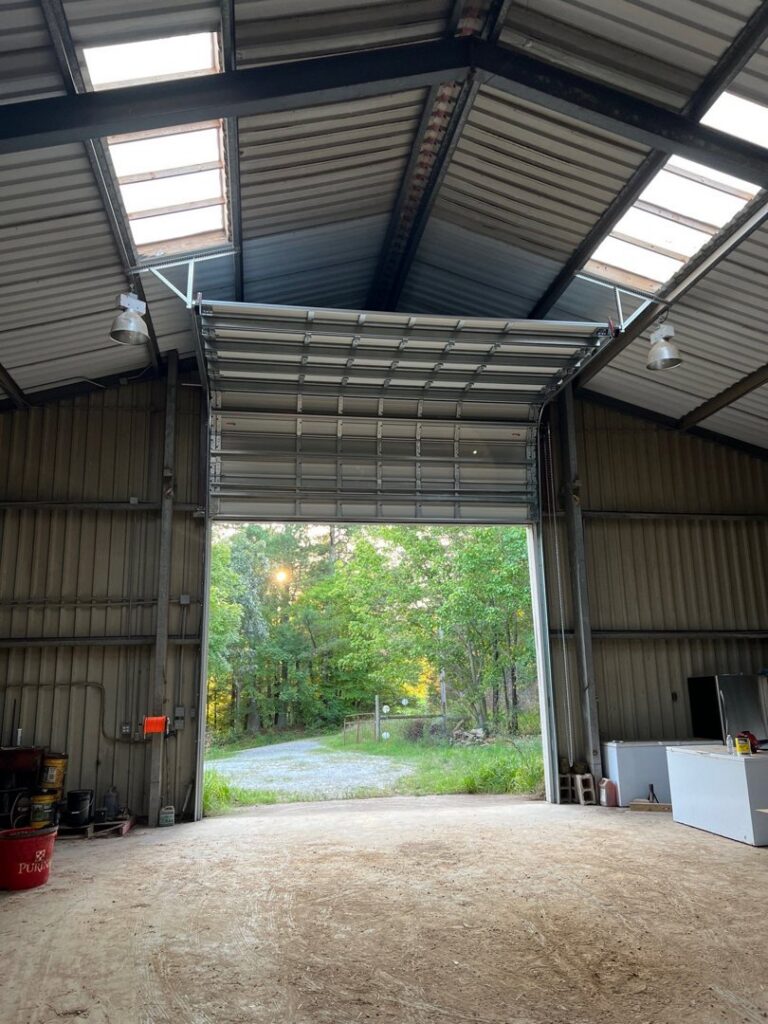 A large commercial overhead garage door installed in a warehouse or industrial building by Northern Door Company in Murfreesboro, TN