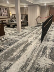 A commercial space featuring a new patterned carpet installation by Christie Carpets & Blinds in Rochester, NY