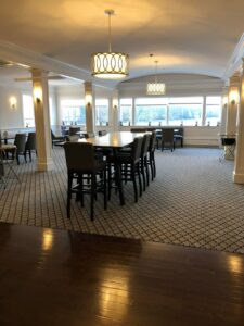 A commercial dining or meeting room with a newly installed patterned carpet by National Carpet and Flooring in Tyngsboro, MA.