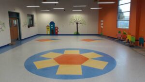 Colorful patterned vinyl flooring installed in a commercial space by Carpets Texas in El Paso, TX.