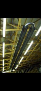 Commercial radiant tube heaters installed on a ceiling by ESR Heating, Cooling and Refrigeration in Raymore, MO.