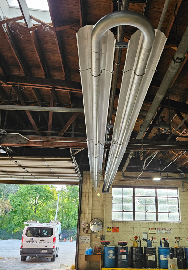 Commercial radiant tube heaters installed in a large building by Dixon's Heating & Air Conditioning, Inc. in Athens, IL