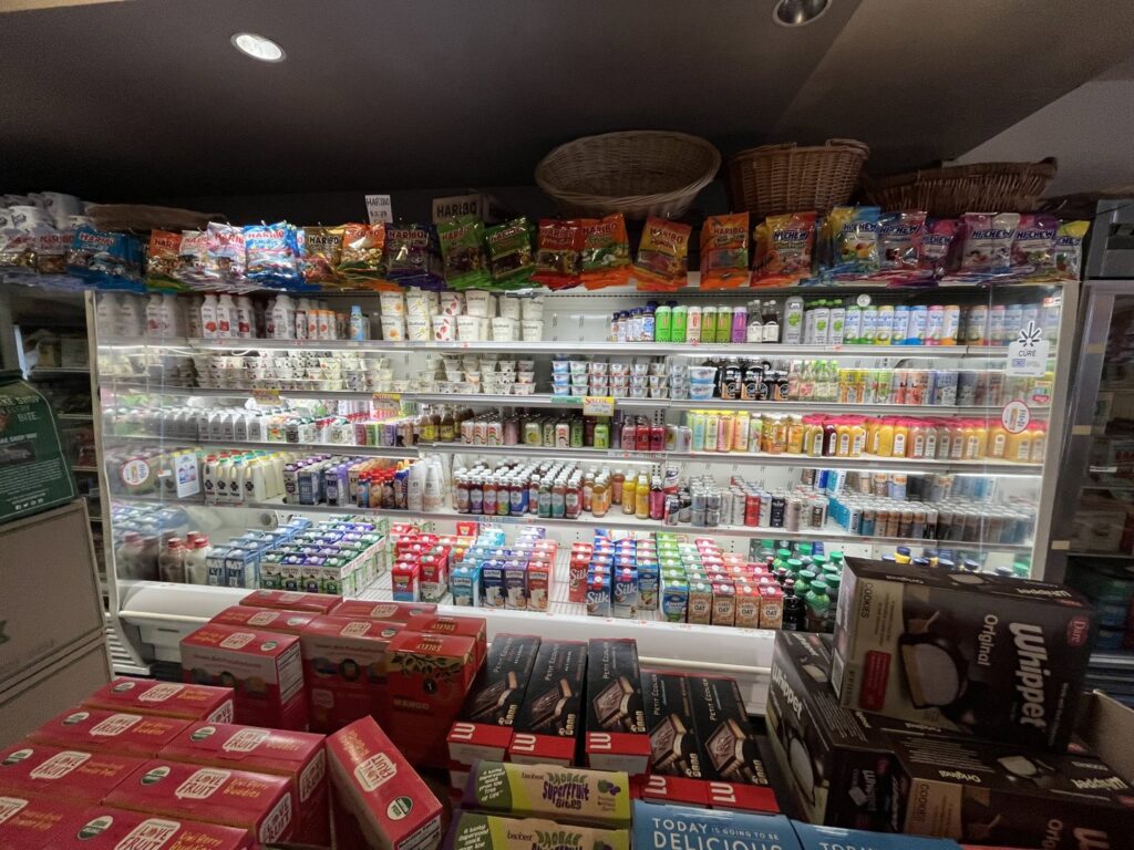 A commercial refrigerated display case filled with various products, maintained by DND Mechanical in Columbus, OH.