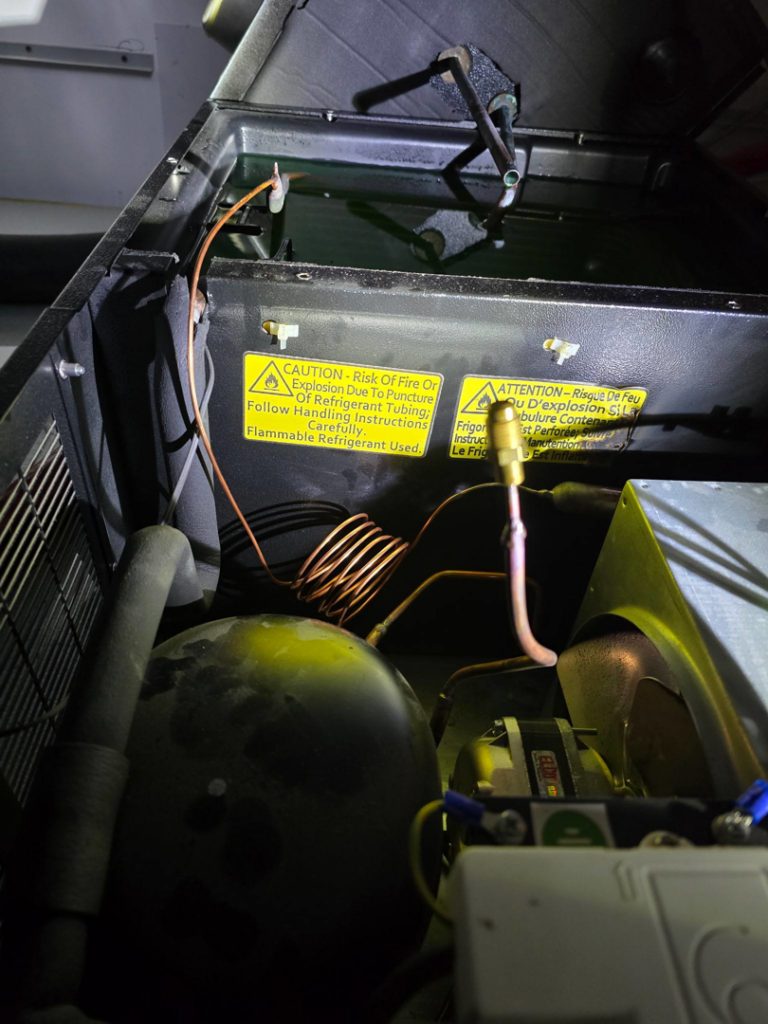 The interior components of a commercial refrigeration unit serviced by Proctor Mechanical & Refrigeration in West Des Moines, IA.