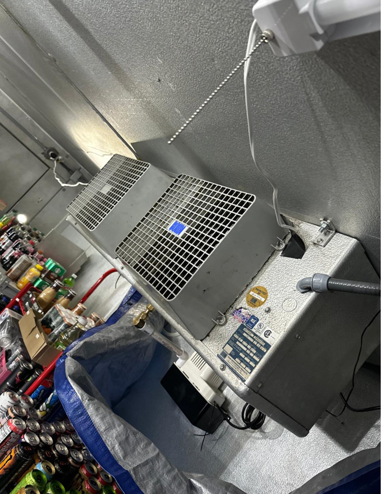 An indoor commercial refrigeration unit being serviced by Brown's Heating & Air Conditioning in Columbia, TN.