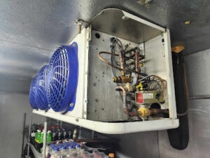 A commercial refrigeration unit being serviced by Utah Mechanical Heating and Air Conditioning in South Ogden, UT.