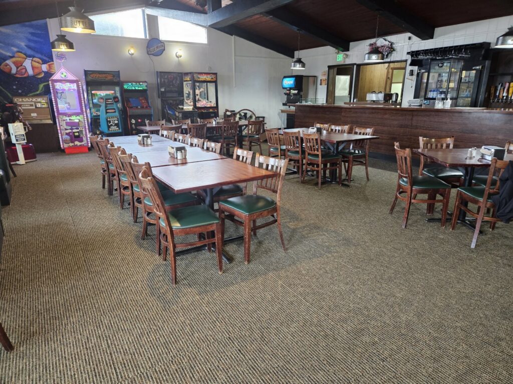 A newly installed commercial carpet in a restaurant dining area by Midwest Coast Flooring in North Bend, OR