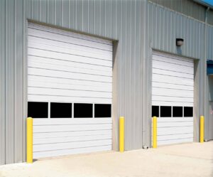 Commercial roll-up garage doors installed on a metal building by Overhead Door Company of Salem in Salem, OR.