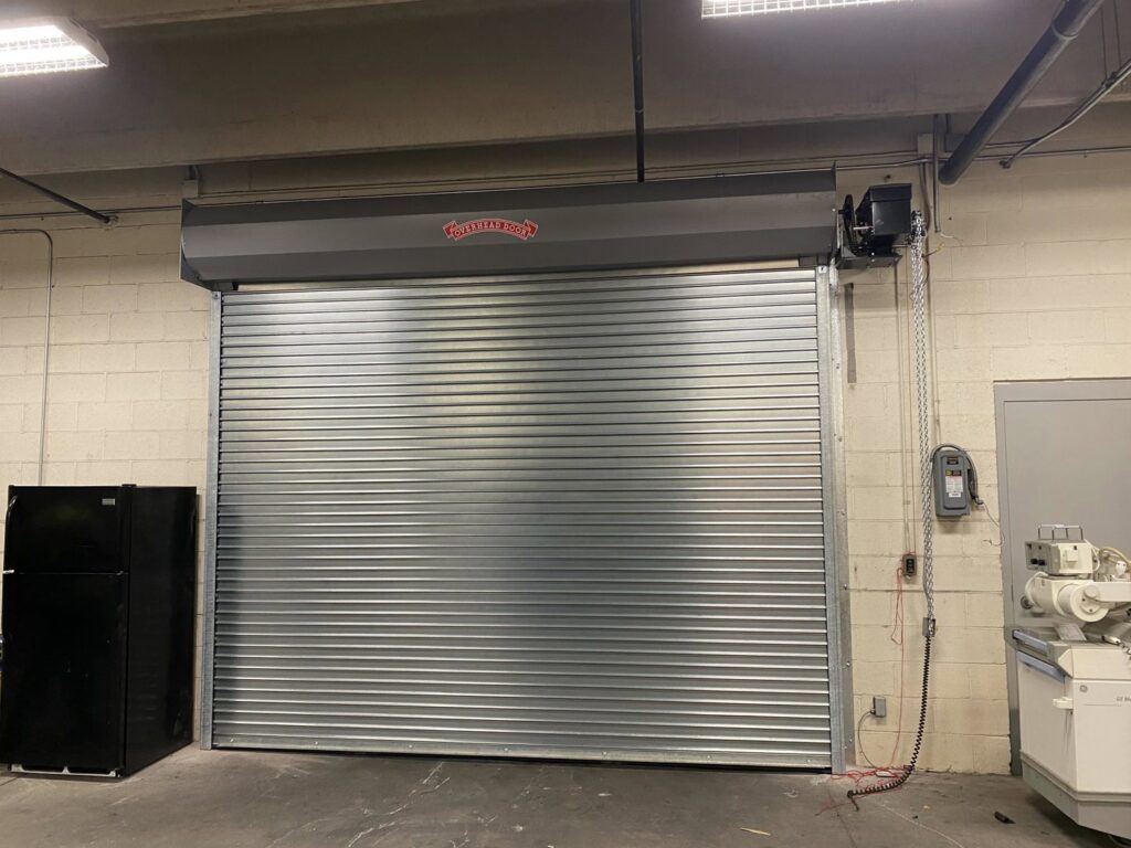 A large commercial rolling steel garage door installed by Overhead Door Company of Maricopa & Pinal County in Mesa, AZ.