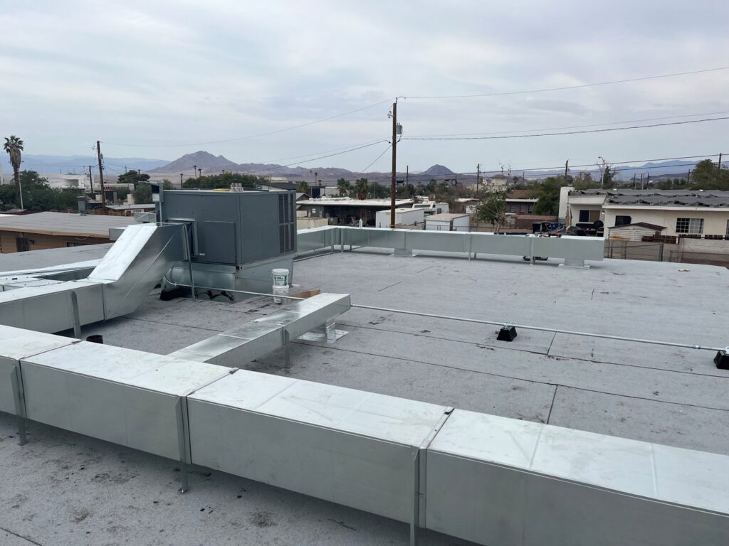 Extensive commercial rooftop ductwork and HVAC unit installed by Instant Air in Las Vegas, NV.
