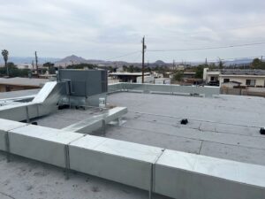 Extensive commercial rooftop ductwork and HVAC unit installed by Instant Air in Las Vegas, NV.