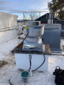 A commercial rooftop exhaust fan unit installed by Finney Heating and Cooling LLC in Post Falls, ID.