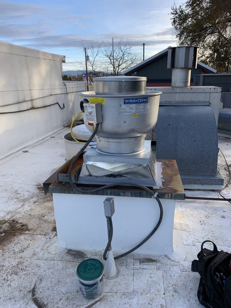 A commercial rooftop exhaust fan unit installed by Finney Heating and Cooling LLC in Post Falls, ID.