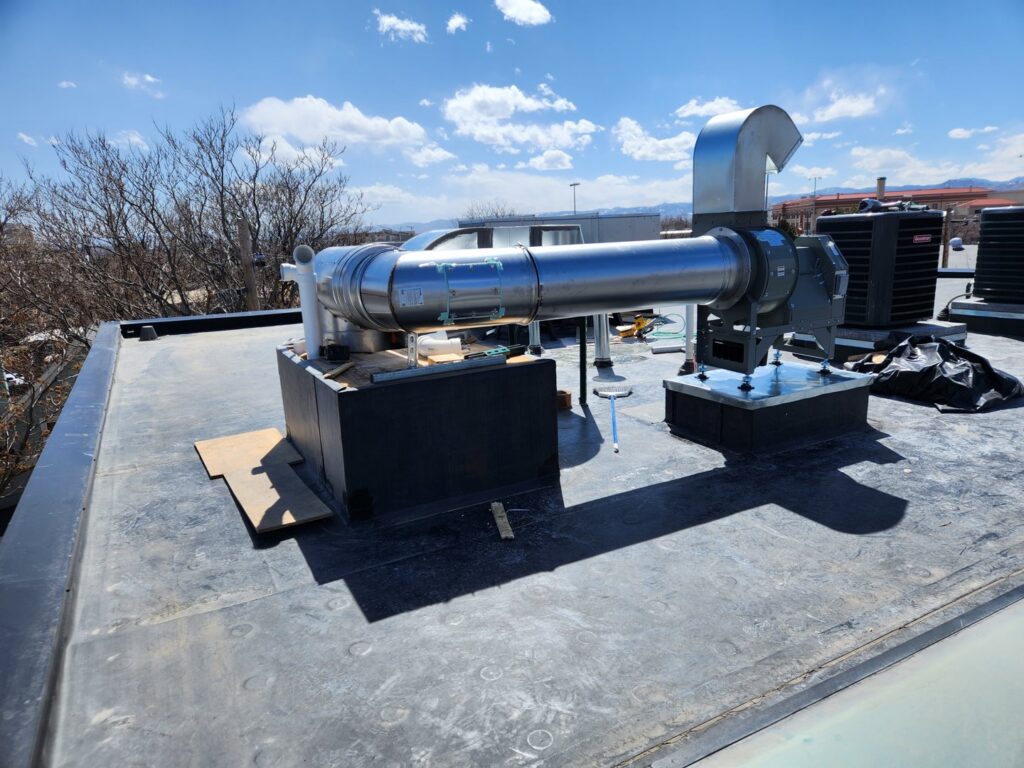 A commercial rooftop exhaust and ventilation system installed by EPCTL Heating and Cooling in Byers, CO.