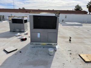 Commercial rooftop HVAC units being installed or serviced by LEWIS AIR LLC in Mesa, AZ.