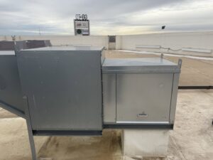 A commercial rooftop HVAC system with connected ductwork, maintained by Four Corners Service Co. in Farmington, NM.