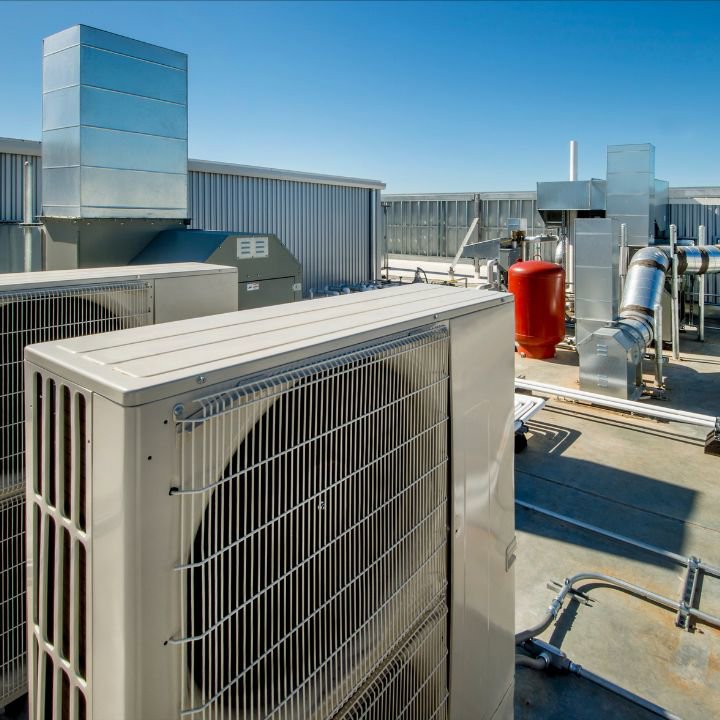 Commercial rooftop HVAC systems and ductwork on a building by All The Way Heating & Cooling in Middleburgh, NY