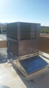 A large rooftop HVAC unit installed on a building by Aircon Heating and Cooling Inc in Las Cruces, NM