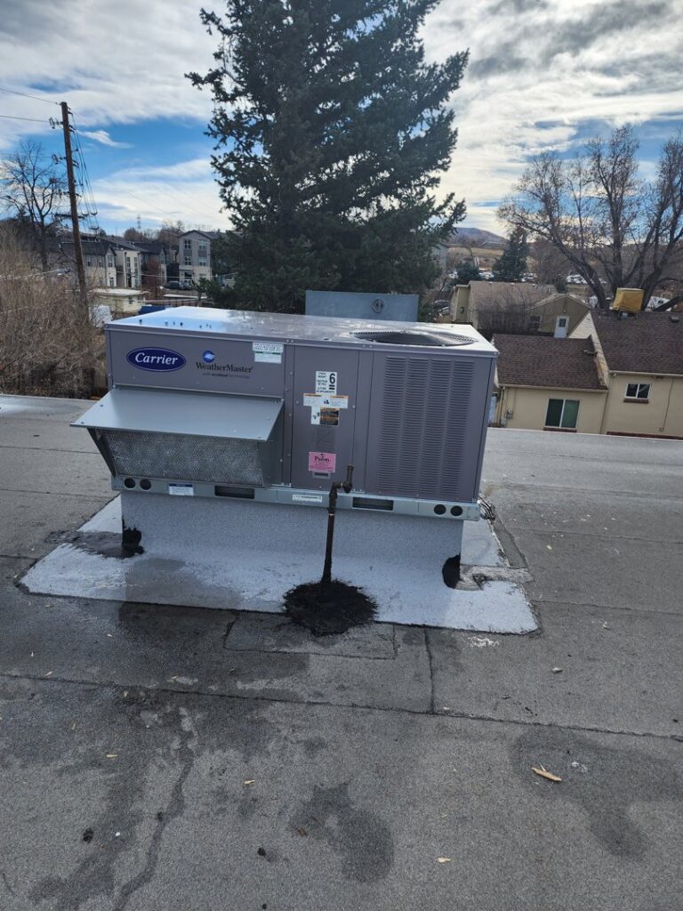 A commercial rooftop Carrier WeatherMaster HVAC unit installed by D & D Heating & Air in Brighton, CO.